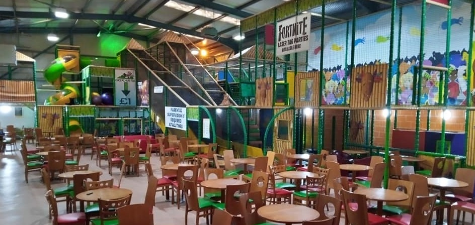 Inside Jungle Madness soft play centre — colourful slides and ball pool